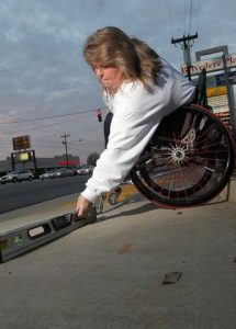 Measuring sidewalk with smartlevel for ADA compliance